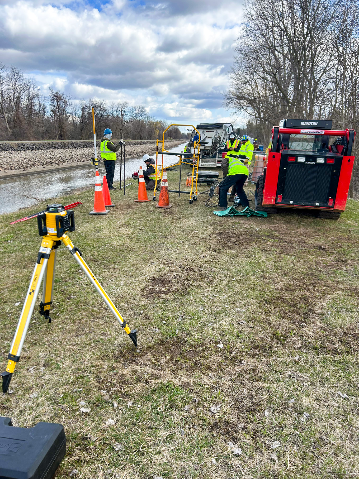 Crew working on the Erie Canal to stabilize the soil and prevent further water erosion.
