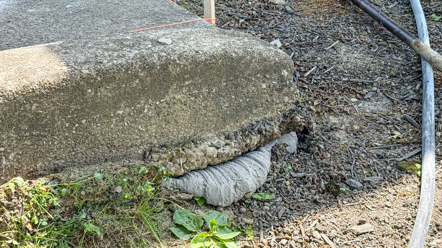 Limestone grout material shown under concrete slab